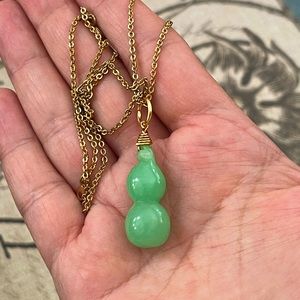 Jade gourd bottle pendant and gold tone metal chain